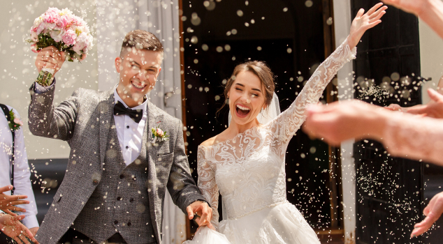 newlyweds exiting wedding venue