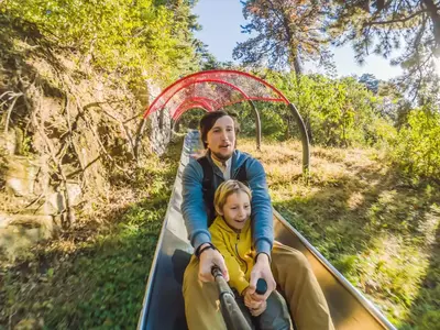 people riding coaster