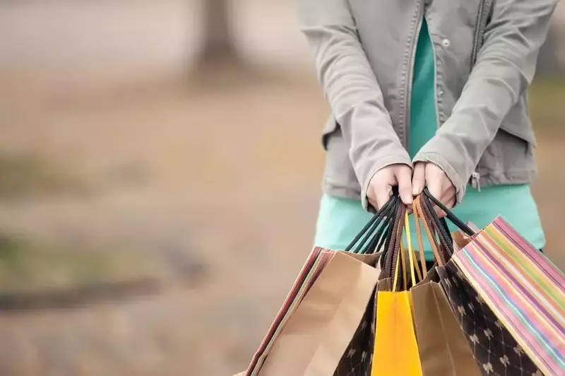 woman holding shopping bags