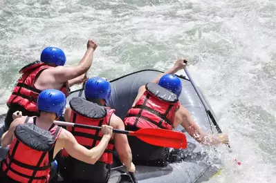 Whitewater rafting over rapids