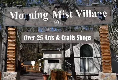 morning mist village sign